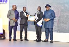 Mr Addo (second from right) receiving the award