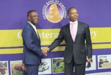 • Mr Baafi (left) with Dr Mangudya after the launch