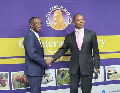 • Mr Baafi (left) with Dr Mangudya after the launch