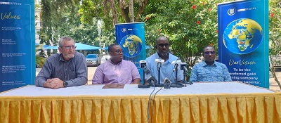 • Mr Coffie addressing the press conference. With him are Mr De Beer (extreme left), Mr Mortoti and a member of the organising team