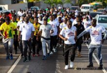 Mr Ussif (second right) leads the walk from Ayi Mensah