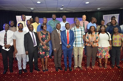 Mr Edward Biney(middle) and Mr Kofi Andoh (fourth from right) with other officals after the programme. Photo. Vincent Dzatse