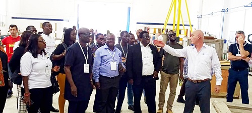 The Managing Director of Sulzer-Mansa (right) taking MrOwusu (second left) and other dignitaries round the facility