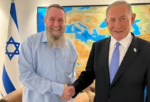 The Noam party leader, AviMaoz (L), shaking hands with Benjamin Netanyahu