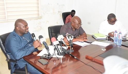 Peter Dery (left) briefing the press
