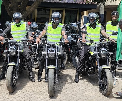 Some police personnel preparing for a test ride on the motorbikes