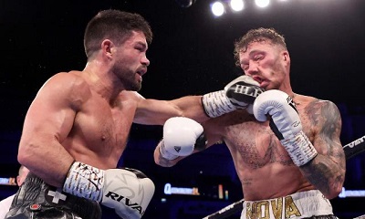 • Ryder (left) connects a left punch to the face of his opponent in the earlier rounds