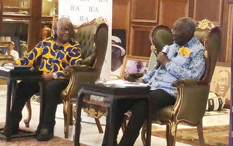 Kufuor (right) speaking at the programme
