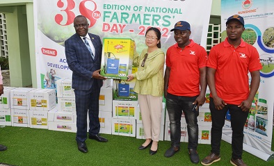 Ms. Rachel Yang(middle) presenting one of the items to Mr Yaw Frimpong Addo (left)Deputy Minister Of Agric In charge of Crops. Photo. Vincent Dzatse