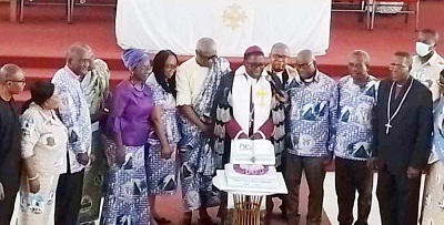 Rev Dr Paul K. Boafo (middle) cutting the bible cake during the programme