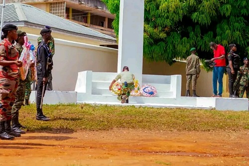 A wreath being laid by an officer during the programme