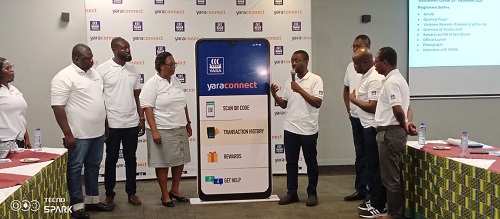 Mr Addo-Yobo (four from right) with some management staff of Yara Ghana launching the application.
