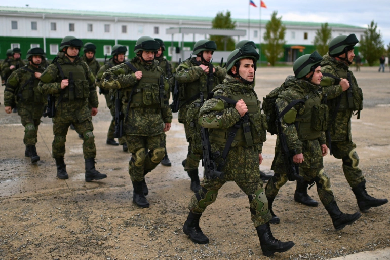 Russian reservists recruited during the partial mobilisation of troops attend a ceremony before departing to the zone of Russia-Ukraine conflict
