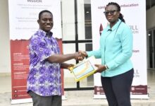 • Mr Abakah receiving the award from Ms Osei