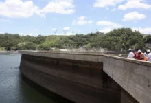 Officials inspect water levels in the Kariba Dam in Zimbabwe.