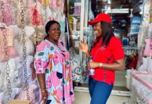 The Chief Executive Officer of Absa Bank Ghana, Abena Osei-Poku (right), interacting with an SME customer