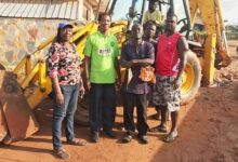 Mr Akoto with other members of the community at the construction
