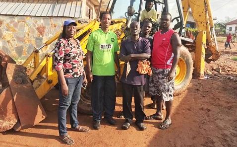 Mr Akoto with other members of the community at the construction