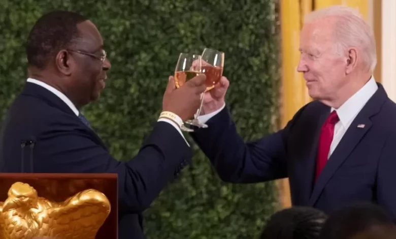 • President Joe Biden (right) proposing the toast at a summit dinner with Senegal’s President Macky Sall