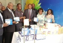 • Dr Ofori (third from left) presenting some of the medical supplies to Dr Ampomah (third from right