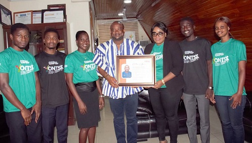 • Mr Hadzide (middle) receiving citation from Miss Akua Opoku-Mensah (third from right)