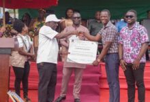• Mr Kingsley Agyei Boahen (left) presenting a citation to Mr Christian Zico Agbebo while others look on
