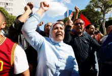 • Thousands of protesters have taken to the streets of Tunis to demonstrate against the president.