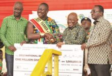 • President Akufo Addo presenting cash prize to Nana Yaw Siriboe the 2022 Best Farmer. With them are Mr Alhassan Yakubu-Tali, MD of ADB and Dr. Owusu Afriyie Akoto Agriculture Minister