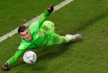 Goalkeeper Dominik Livakovic dives to his right to make the match-winning save that handed Croatia the qualification ticket