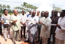 • Otobour Gyan Kwasi II (third from right) Aburihene being assisted by Dr Samir Kalmoni (second from left) with other officials to officially cut the tape to inaugurate the centre
