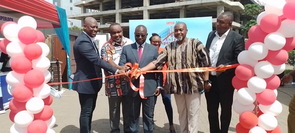  Mr Asenso-Boakye together with other dignitaries cutting the ribbon to officially open the Housing Fair