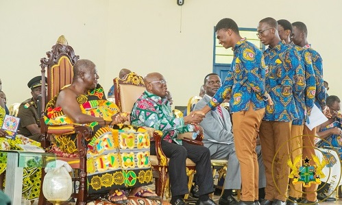 President Akufo- Addo exchanging pleasantries some of the students, while Otumfuo Osei Tutu II looks on