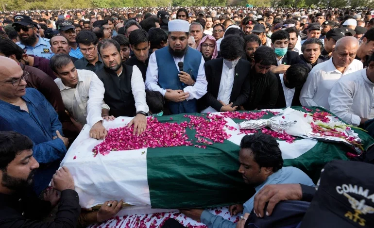 People attend the funeral prayer of slain senior Pakistani journalist Arshad Sharif, in Islamabad, Pakistan