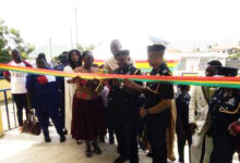 • Inset: Police officials cutting the tape inaugural the building