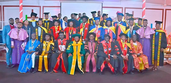 • Apostle Dr Wilson (seated fourth from left) with the graduates and other dignitaries after the programme