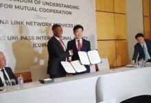• Mr Adjei (left) exchanging the MoU documents with his South Korean counterpart