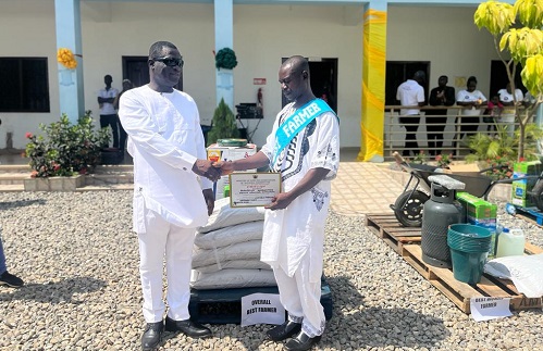 Mr. Frederick Acheampong (right) receiving his award from Mr Kofi Ofori (left) MCE of Ablekuma North Municipal