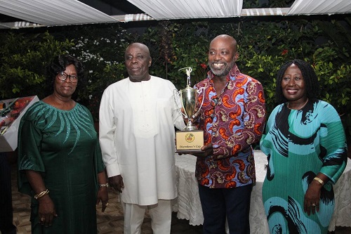 • The Okyenhene (second left) congratulating Mr Adu Jr on winning the tournament. With them include Okyenhemaa, Nana Dokua (left)