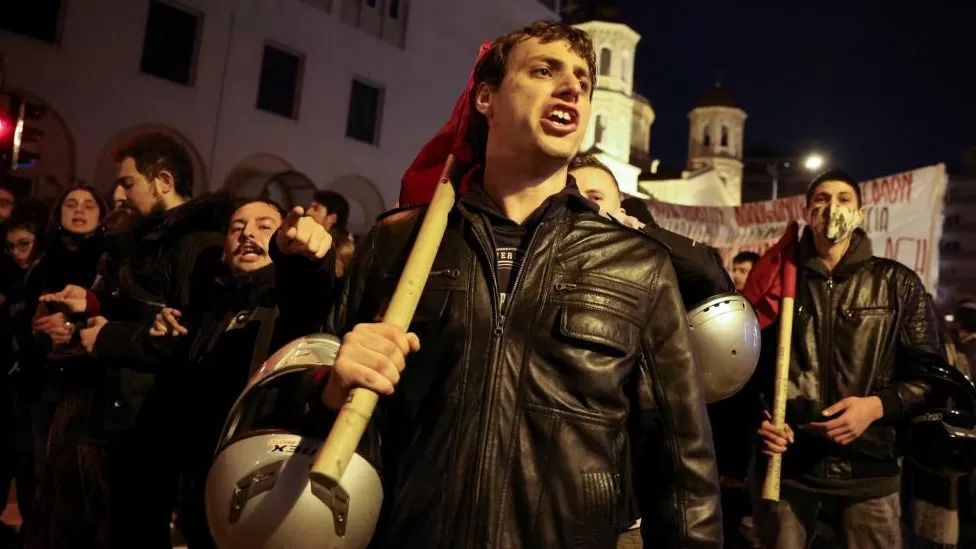 Protesters clashed with police in Thessaloniki as the teenager lay in a critical condition in hospital