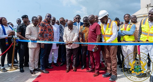 • President Akufo-Addo (middle) cutting the tape to open the facility