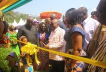• President Akufo-Addo (right) cutting the tape to open the festival