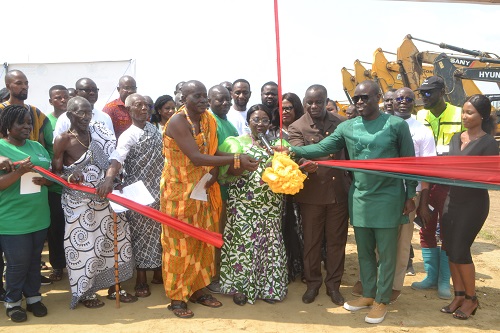 Inset, Mrs Osei-Opare (middle) being assisted by Mr Ofori-Ataa and other dignitaries to cut the tape for the official launch of the project Photo Victor A. Buxton