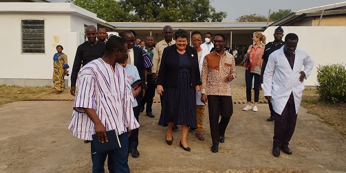 • Ms Palmer and health director (left) accompanied by some staff of the medical store touring the facility