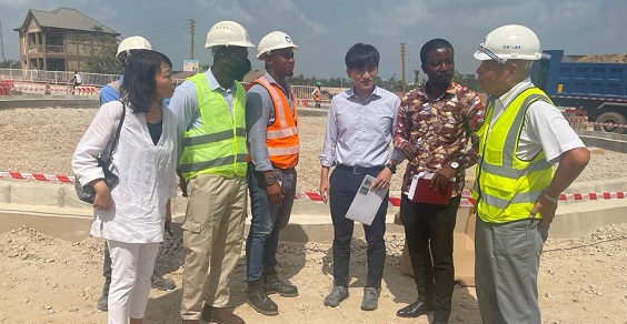 • Mr Akihisa (third from right) interacting with other officials during an inspection tour