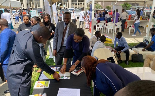 • Mr Krapa (left) interacting with some an exhibitor