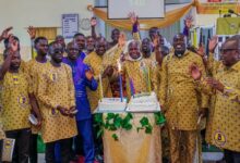 • Leaders of the church and dignitaries about to cut the annivesary cake