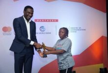 Mbamba Hadija, winner of the pitch(right), receiving her award from Mr Khailann