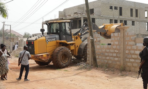 • Bulldozers collapsing some structures on Mempeasem in Accra