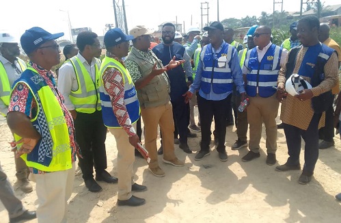 • (inset) Mr Amoako-Atta (fourth from left) in a discussion with the directors and the consultant during the road inspection