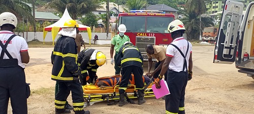 • A team attempting to put a victim into an ambulance
